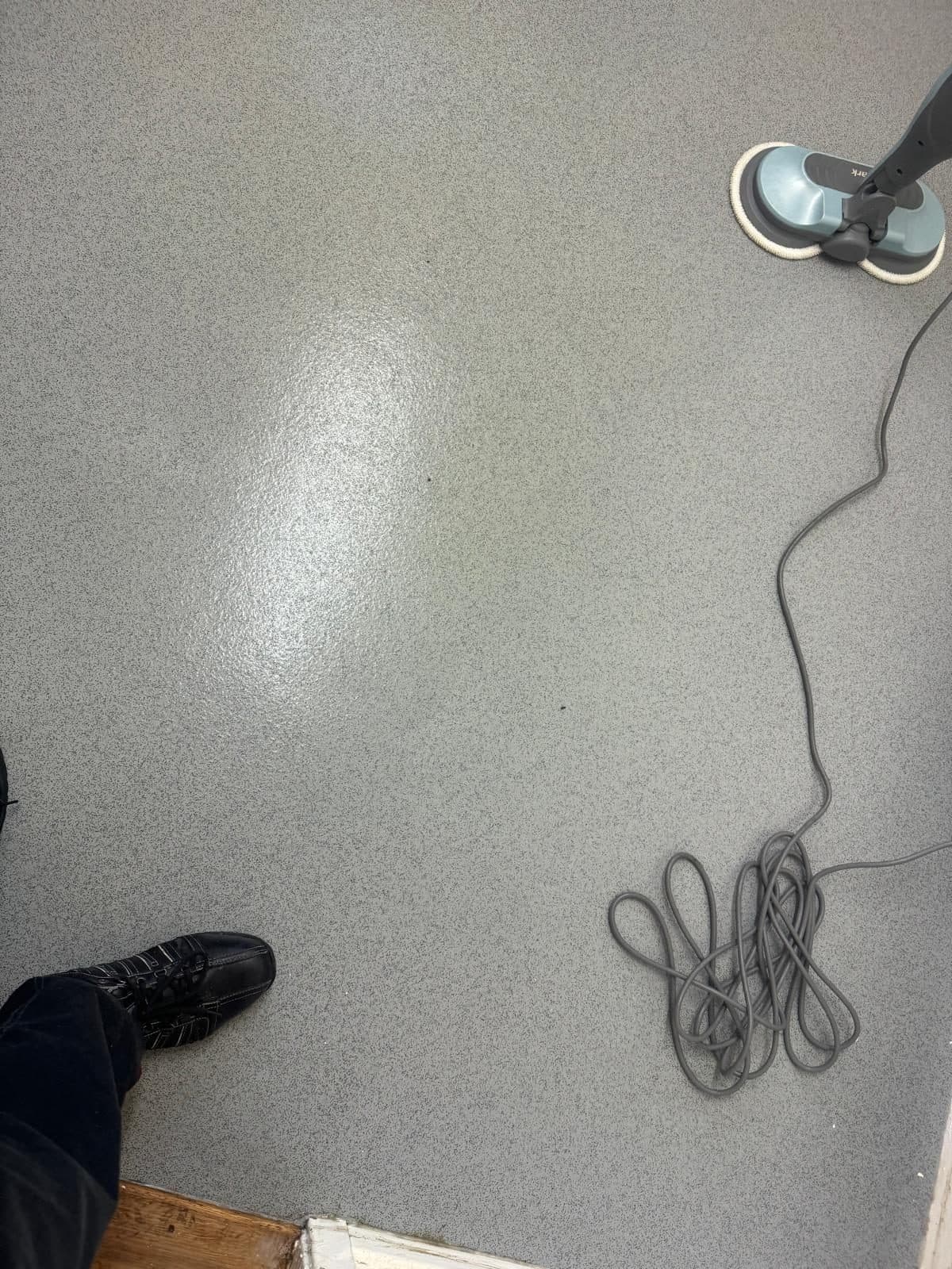 The floor near the doorway after cleaning